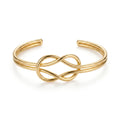QIAOREN 12676 Trendy Minimalist Interlocked Eternal Knot Wide Cuff Bangle 18K Gold Plated Hypoallergenic Stainless Steel Women's