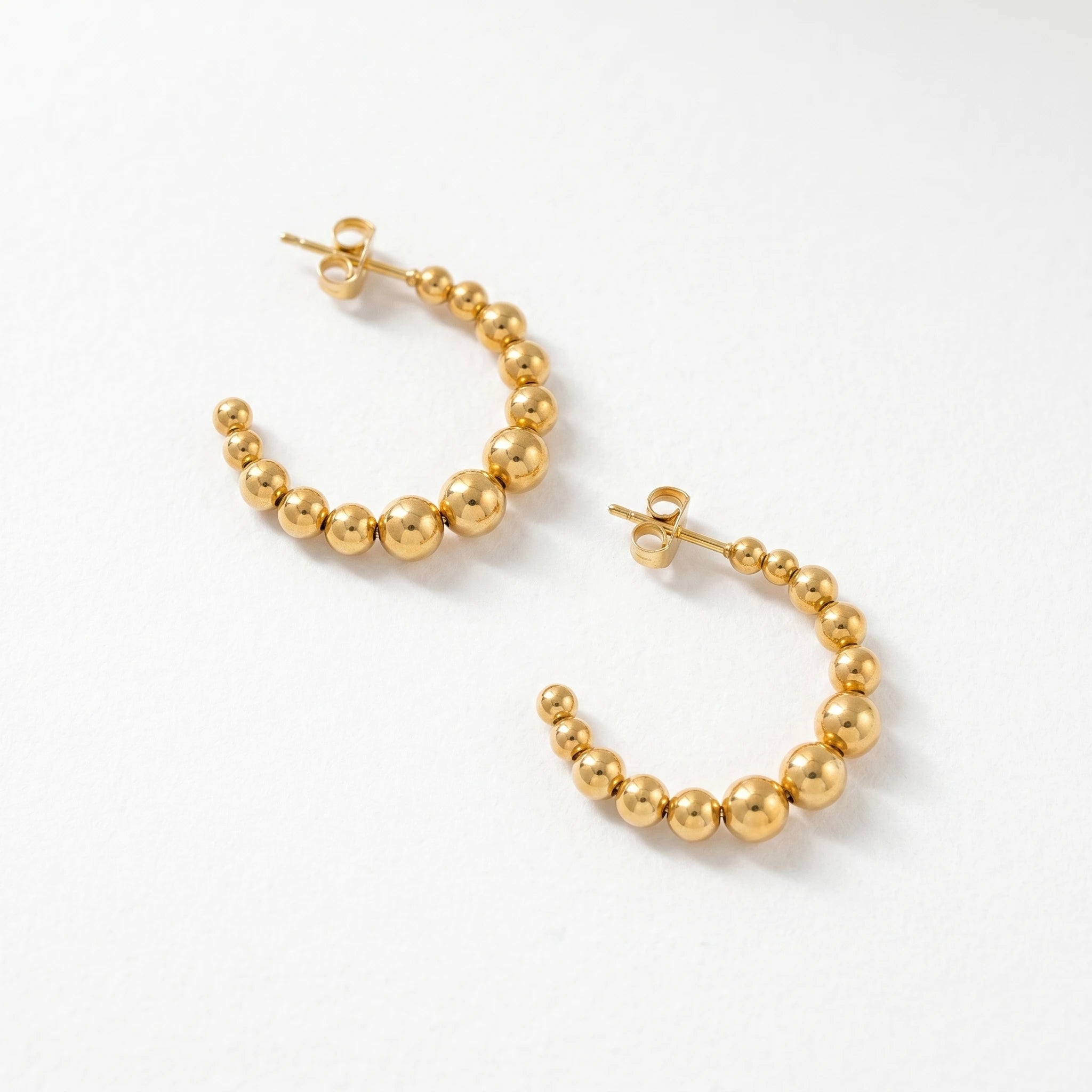 QIAOREN 12416 Elegant Quiet Luxury Spherical Hoop Earrings Gold Stainless Steel Sleek Graduated Beads C-Shaped Statement Studs
