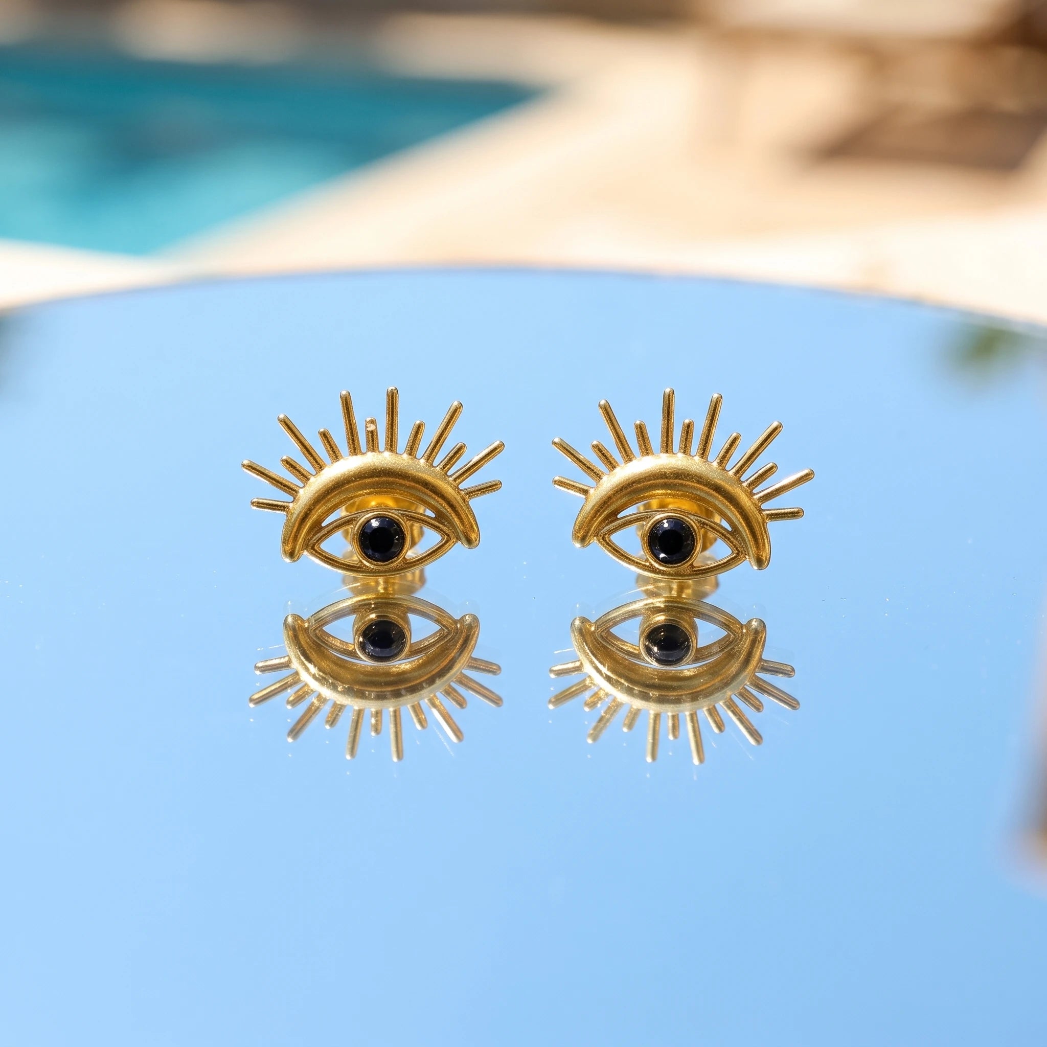 QIAOREN 14033 Matte Gold Stud Earrings With Sunburst Spike Detail, Black Round Bead Inlay Protective Symbol Ear Stud