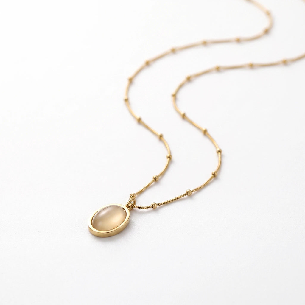 QIAOREN 13510 Dainty Beaded Snake Chain Oval Cream Cat Eye Pendant Necklace, Smooth Gold Frame Natural Stone Necklace