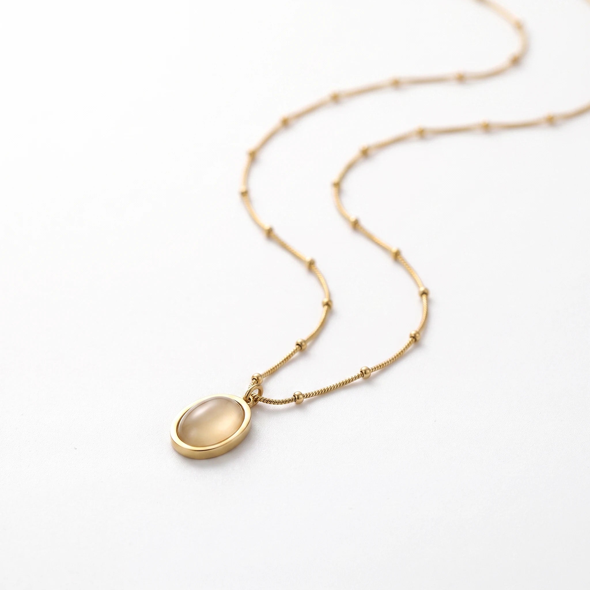 QIAOREN 13510 Dainty Beaded Snake Chain Oval Cream Cat Eye Pendant Necklace, Smooth Gold Frame Natural Stone Necklace