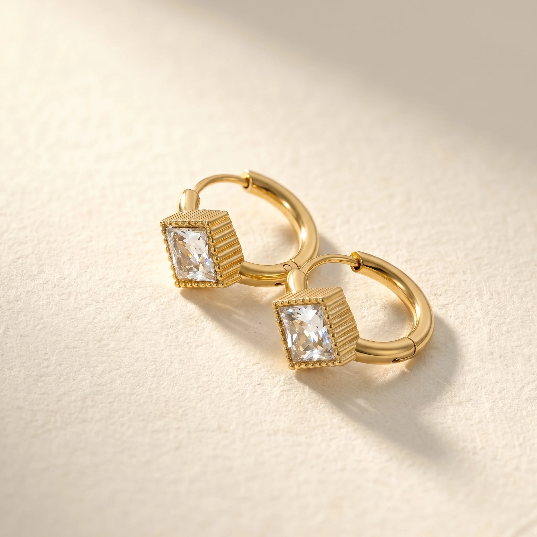 QIAOREN 12121-24 18K Gold Plated Stainless Steel Huggie Hoop Earrings Princess Cut Square CZ Inlaid Textured Bezel Ear Buckle