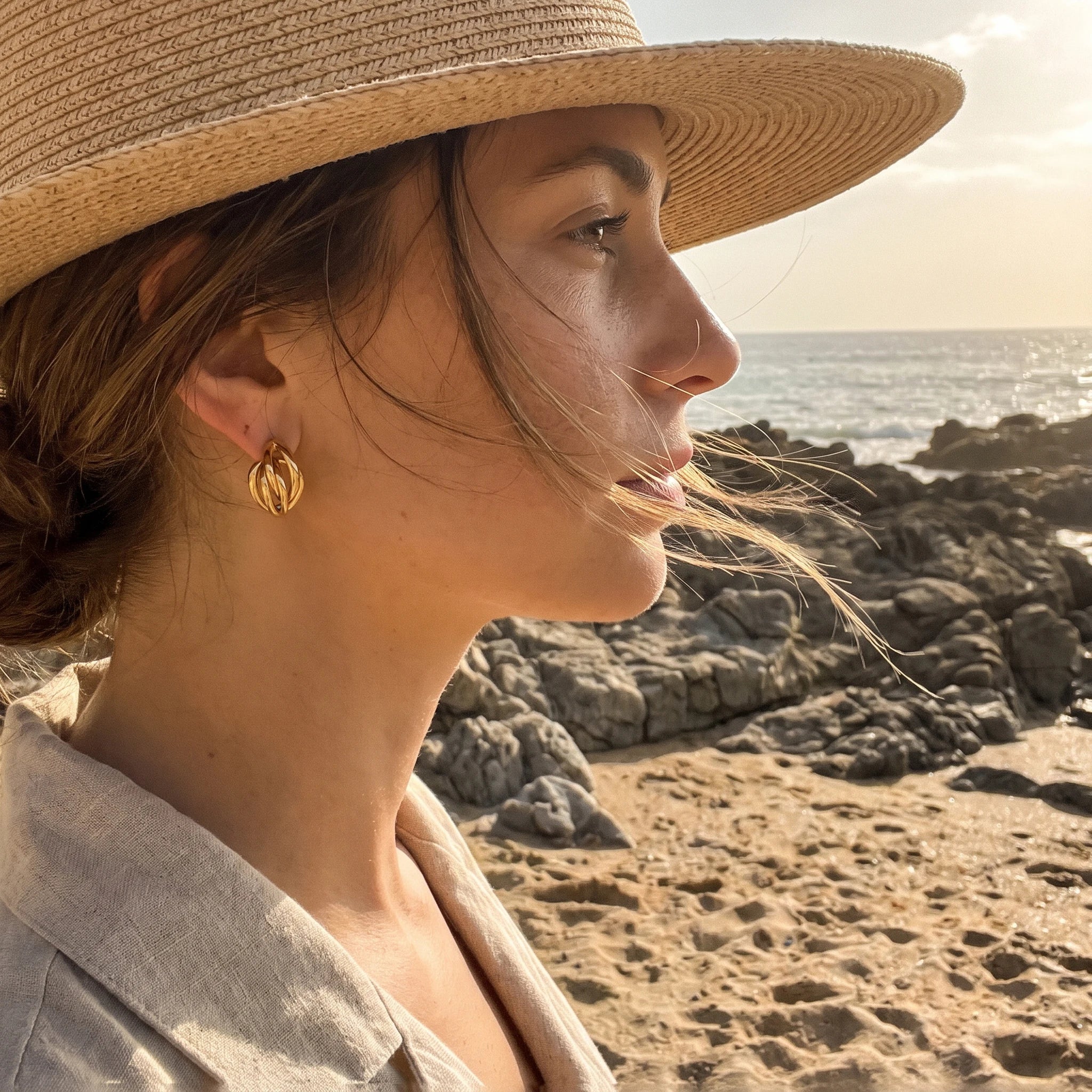 QIAOREN 14541 Twisted Knot Stud Earrings, Polished Gold Interlocked Hoop Earrings, Hypoallergenic Minimalist Statement Jewelry