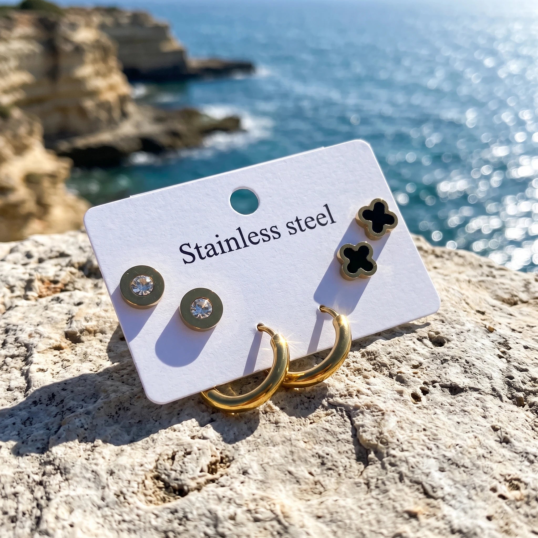 QIAOREN 14472 3 Pair Gold Stainless Steel Earrings Set, Round Disc CZ Studs, Black Enamel Clover Studs & Smooth Huggie Hoops