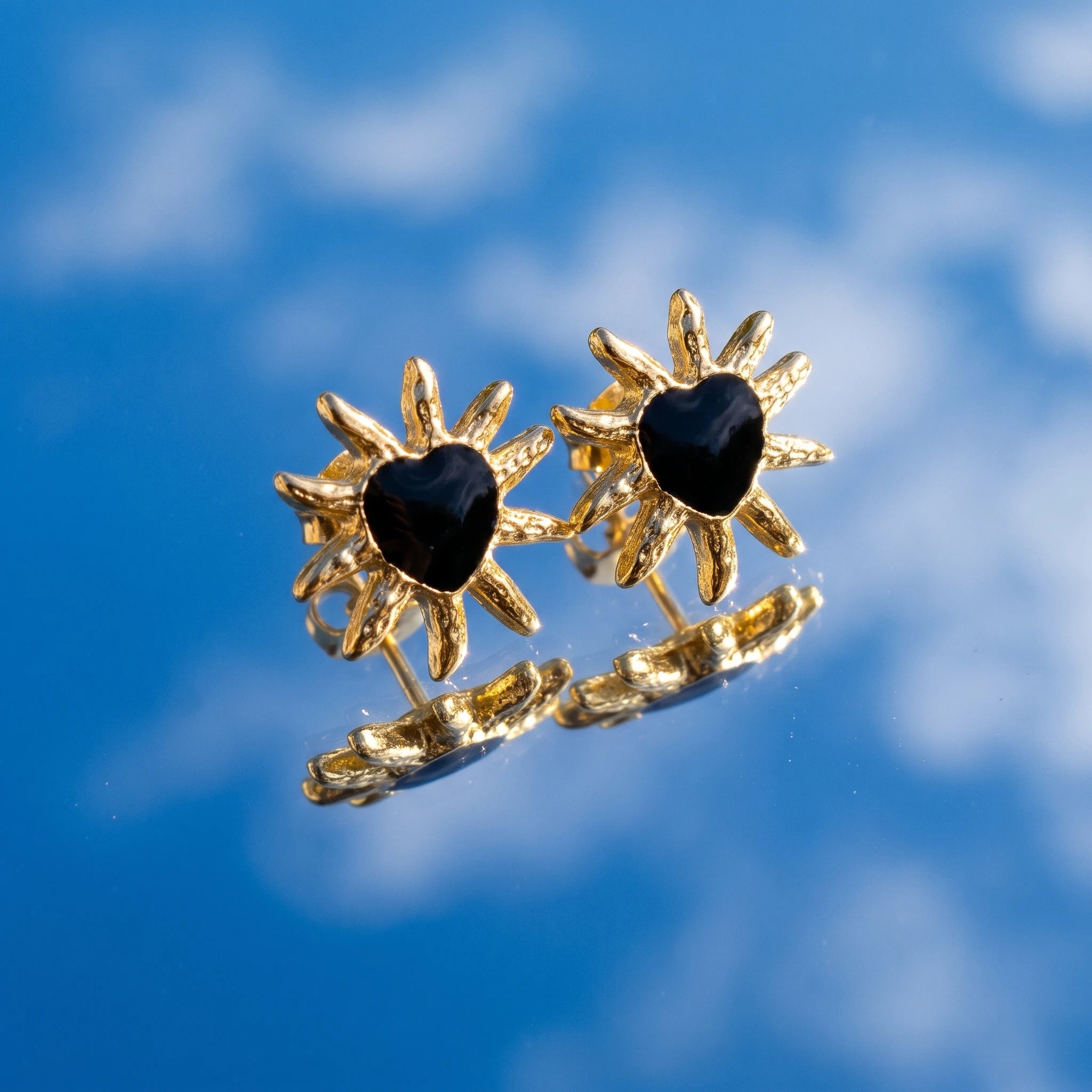 QIAOREN 14035 Matte Gold Sunburst Heart Stud Earrings, Irregular Spike Sun Shape With Black Enamel Heart Center