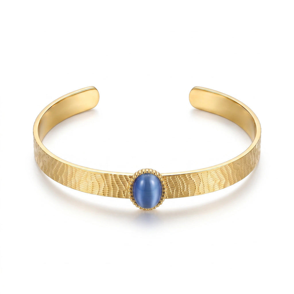 QIAOREN 13665 Textured Wave Open Cuff Bracelet with Oval Blue Cat Eye Stone Bezel Setting, Matte Brush Gold Adjustable Wrist