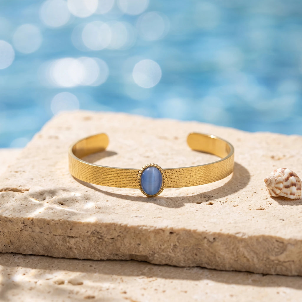 QIAOREN 13665 Textured Wave Open Cuff Bracelet with Oval Blue Cat Eye Stone Bezel Setting, Matte Brush Gold Adjustable Wrist
