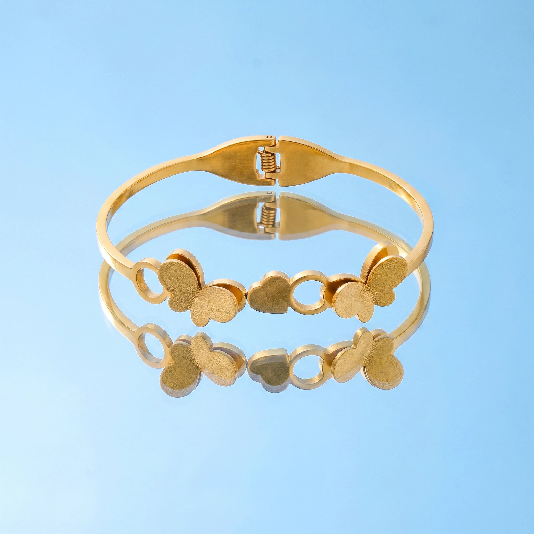 QIAOREN 13657 Spring Cuff Bangle Bracelet with Double Matte Butterfly & Hollow Circle Combined Charms, Polished Thin Bangle