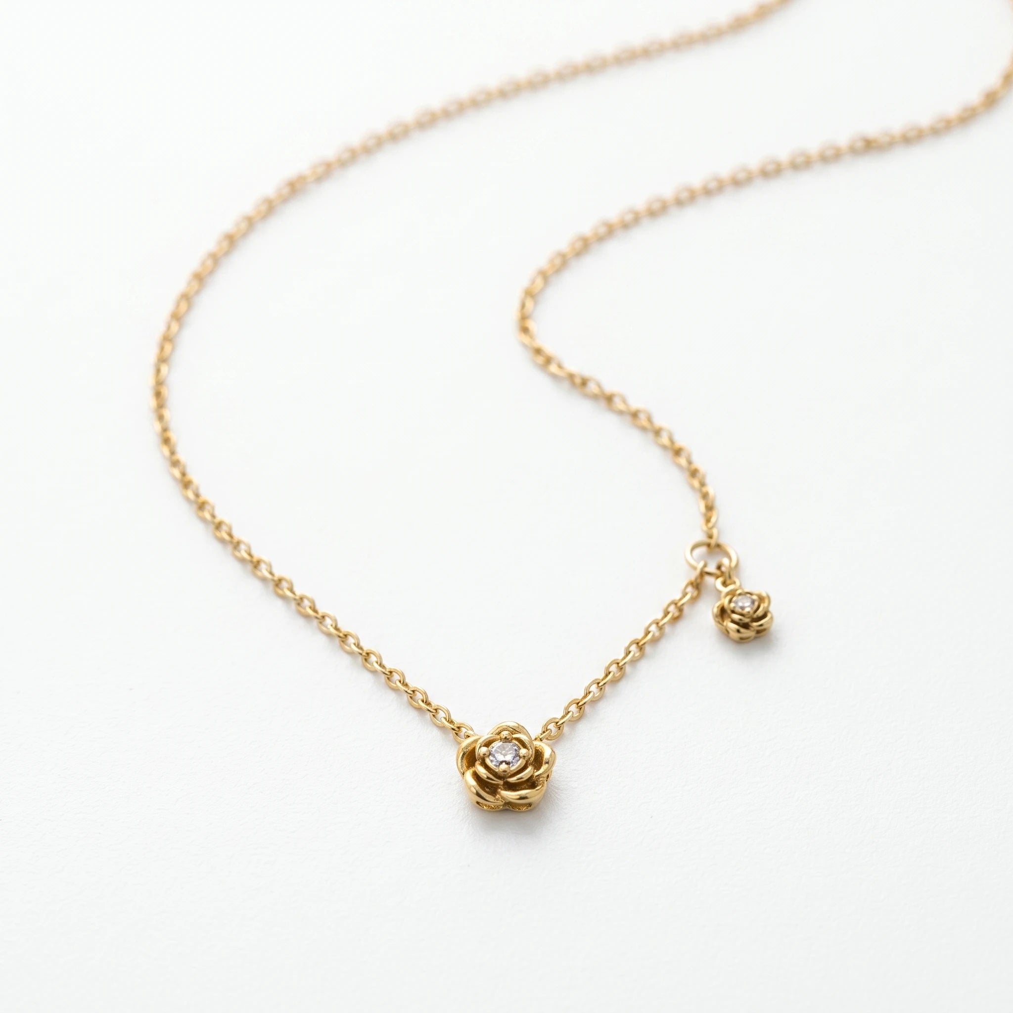 QIAOREN 13724 Thin Cable Chain Necklace with Two Hollow Layered Flower Charms Inlaid Single Round Clear Zircon Jewelry