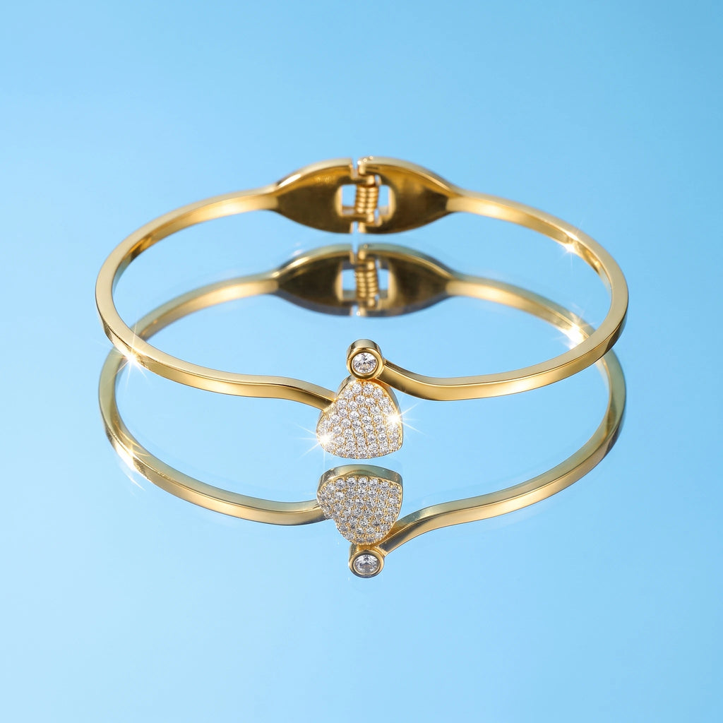 QIAOREN 13653 Thin Wire Spring Cuff Bangle with Paved Zircon Heart & Tiny Single Crystal Dual Charms, Polished Gold Open Bangle