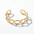 QIAOREN 12706 Minimalist Interlocked Ellipse Cutout Wide Cuff Bangle Hypoallergenic Stainless Steel Gold Bracelet Party Gift