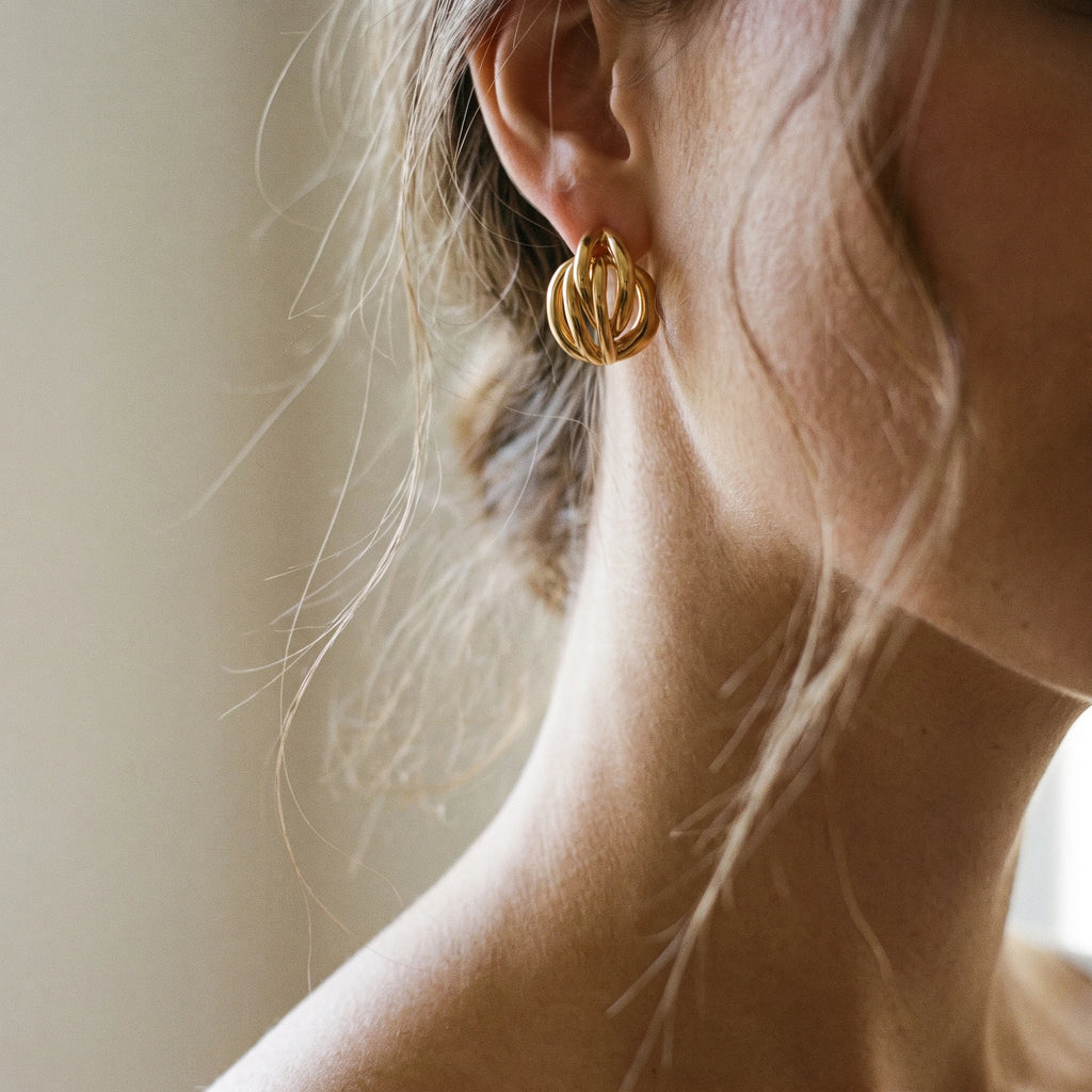 QIAOREN 14541 Twisted Knot Stud Earrings, Polished Gold Interlocked Hoop Earrings, Hypoallergenic Minimalist Statement Jewelry