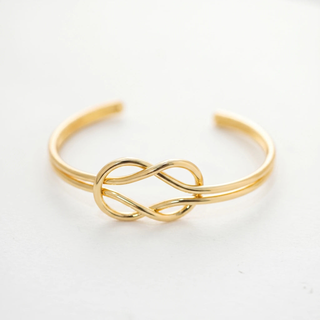 QIAOREN 12676 Trendy Minimalist Interlocked Eternal Knot Wide Cuff Bangle 18K Gold Plated Hypoallergenic Stainless Steel Women's