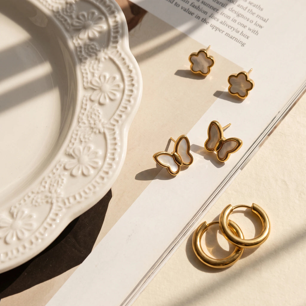 QIAOREN 14473 3 Pair Gold Stainless Steel Earrings Set, Quartz Inlay Flower Studs, Shell Butterfly Studs & Smooth Huggie Hoops