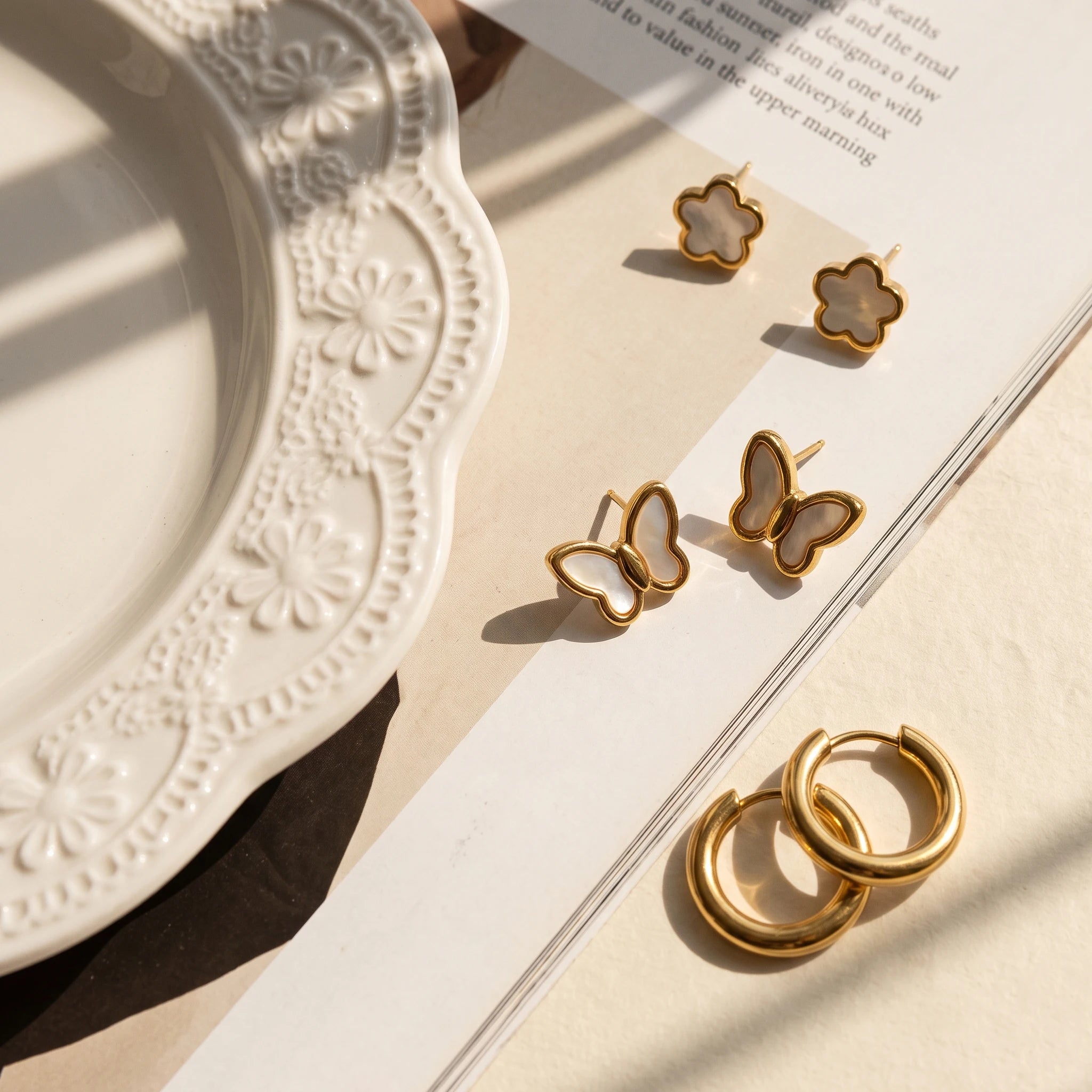 QIAOREN 14473 3 Pair Gold Stainless Steel Earrings Set, Quartz Inlay Flower Studs, Shell Butterfly Studs & Smooth Huggie Hoops