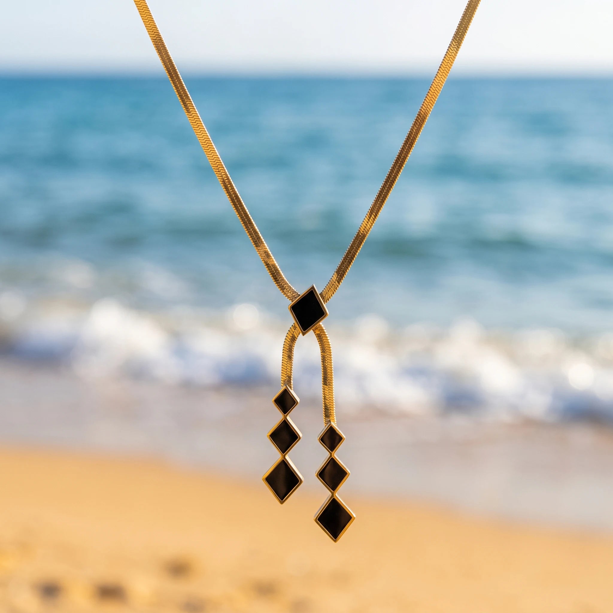QIAOREN 13800 Thin Flat Herringbone Snake Chain Pendant Necklace with Sliding Black Enamel Square Charm & Two Tassel Strands