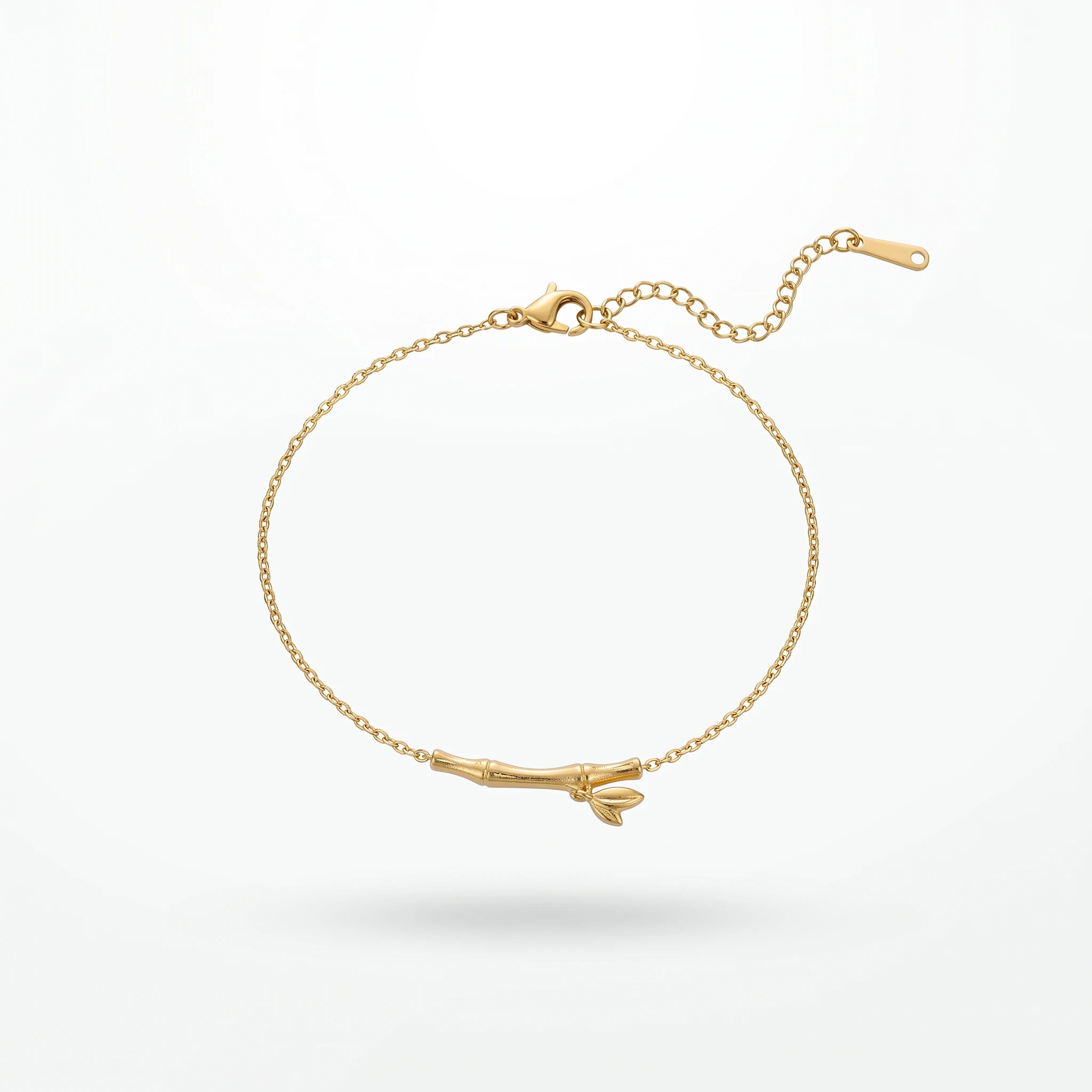 QIAOREN 13769 Thin Oval Link Adjustable Anklet with Matte Textured Bamboo Bar Charm with Tiny Leaf Detail