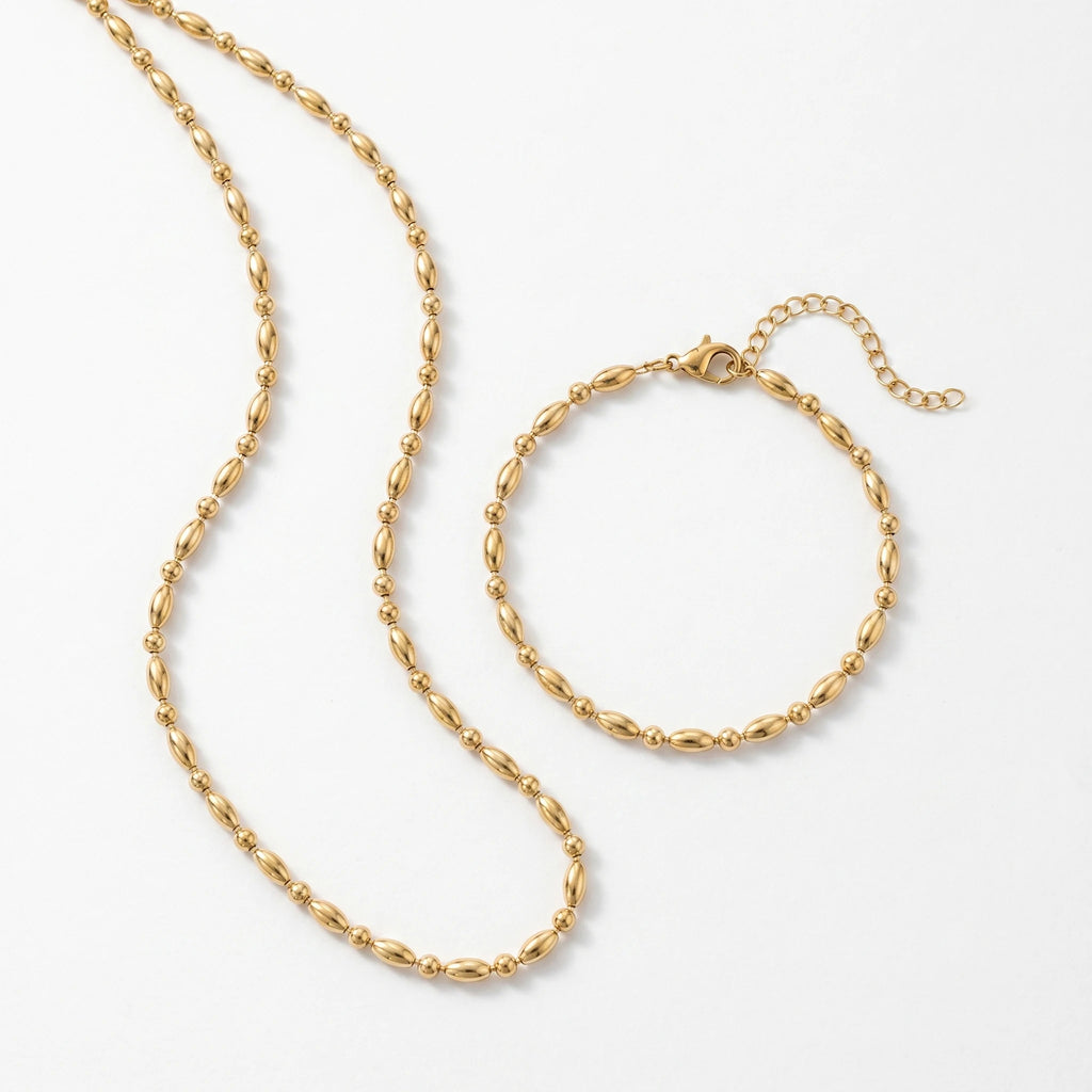 QIAOREN 11632 Waterproof 18K Gold Plated Stainless Steel Rice Bead Jewelry Set Necklace Bracelet Daily Wear