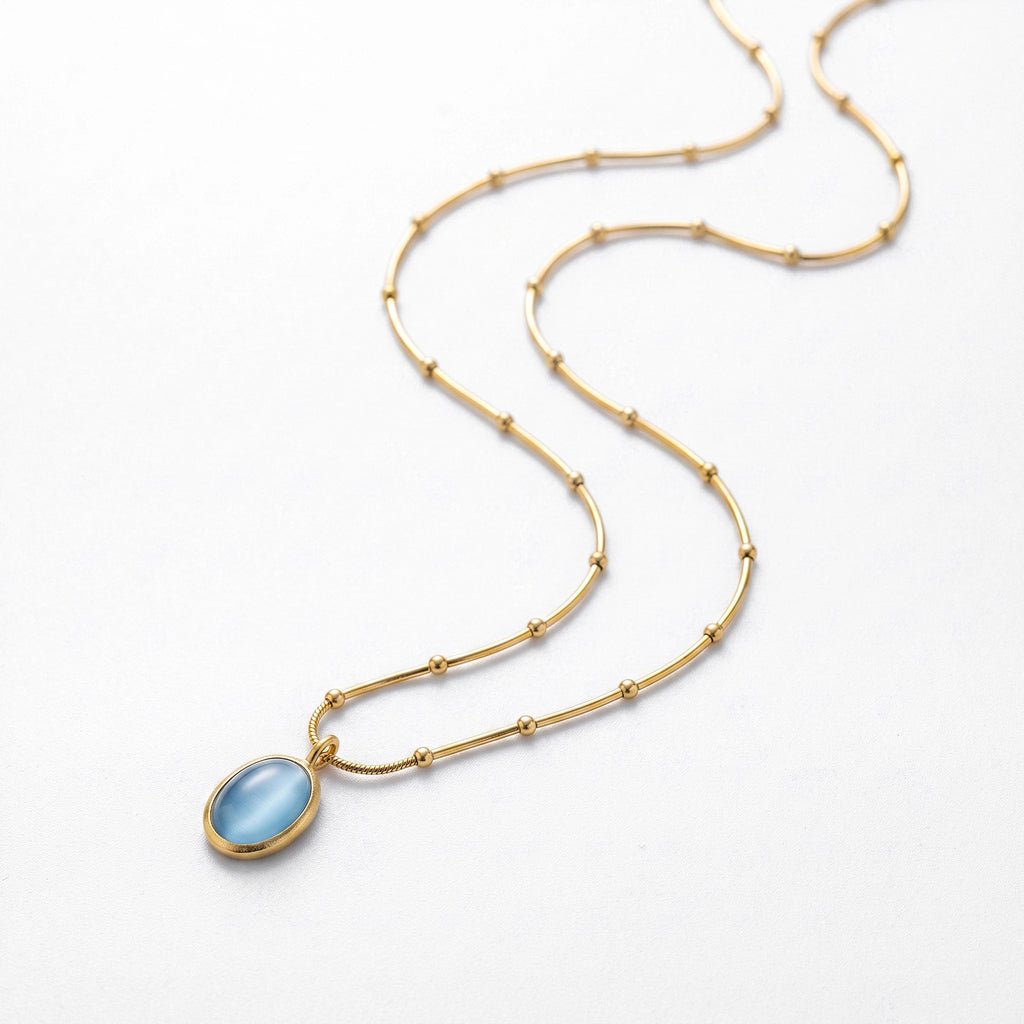 QIAOREN 13477 Dainty Beaded Snake Chain Oval Light Blue Cat Eye Pendant Necklace, Minimalist Cool Tone Necklace