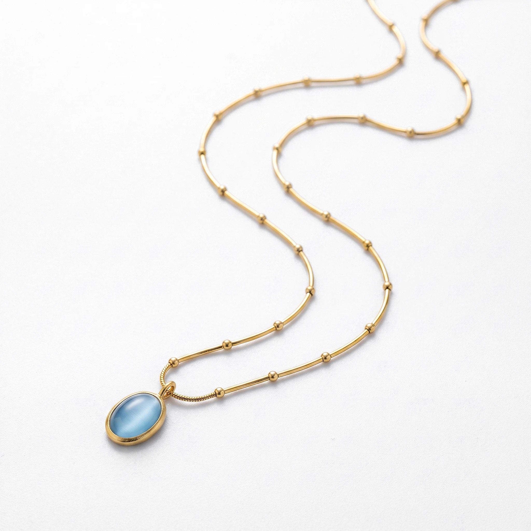 QIAOREN 13477 Dainty Beaded Snake Chain Oval Light Blue Cat Eye Pendant Necklace, Minimalist Cool Tone Necklace